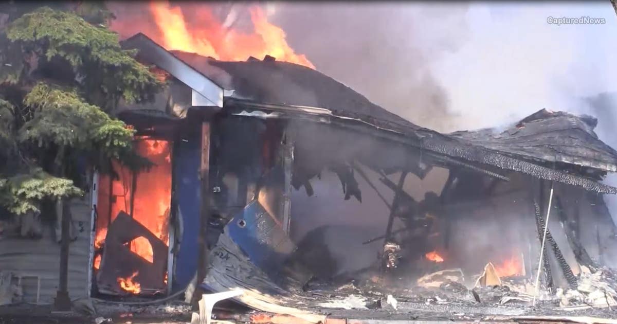 Neighbors say a loud explosion shook the street right before fire ...