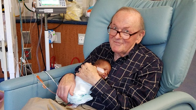 82-year old man cuddles NICU babies