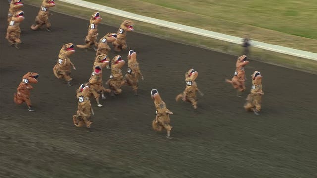 T-Rexes race to the finish line at horse track in hilarious video