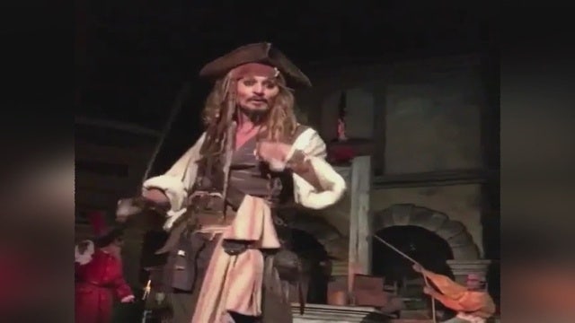 Johnny Depp surprises guests in costume on 'Pirates of the Caribbean' ride