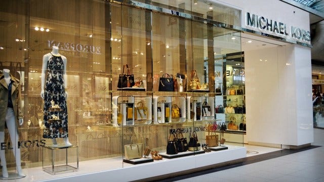 Michael Kors to shutter more than 100 stores