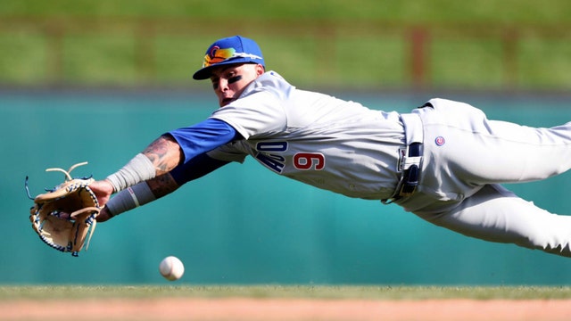 Baez hits 2 HRs as Cubs open season with 12-4 win at Rangers