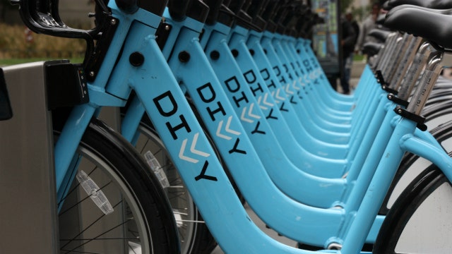 Divvy bike rider clipped by CTA train after riding around gates