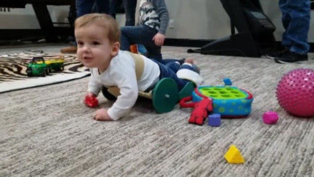 This dad's invention helps his 2-year-old with spina bifida crawl on his own