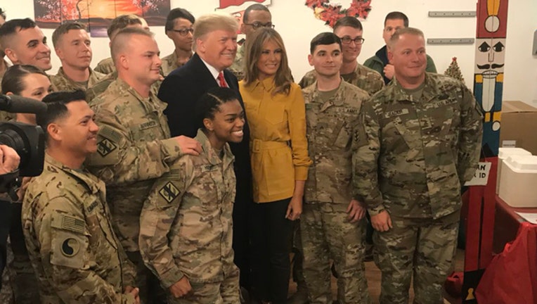 17430751-President Trump with troops-401720