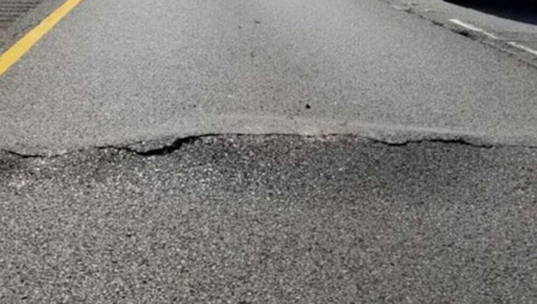25fae5c8-buckled-pavement_1497114897132.png