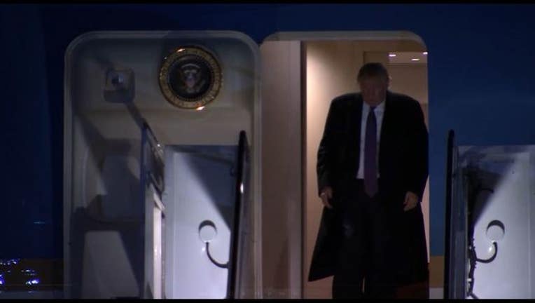 28c2c878-President Trump leaves Air Force One