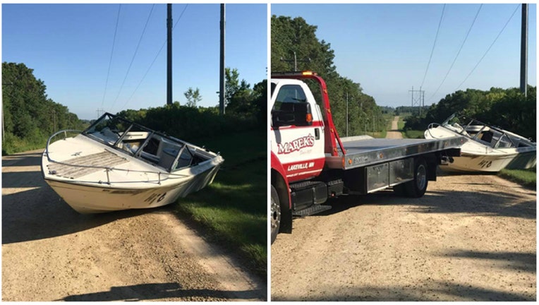 3070b8a6-Someone abandoned this boat on a rural road in Minnesota