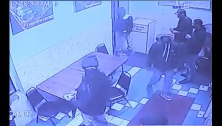 4a6ce53b-Surveillance image of a shooting inside a Little Village restaurant