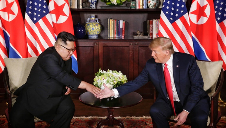 4e3abd18-GETTY-Trump-Kim-Jong-Un_1528800845715.jpg