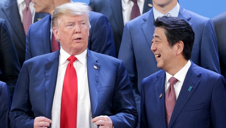 53b715c4-GETTY President Donald Trump and Japanese Prime Minister Shinzo Abe