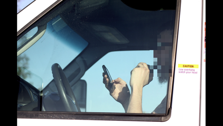 53cd13f4-driving with phone_1494806683941-407068.png