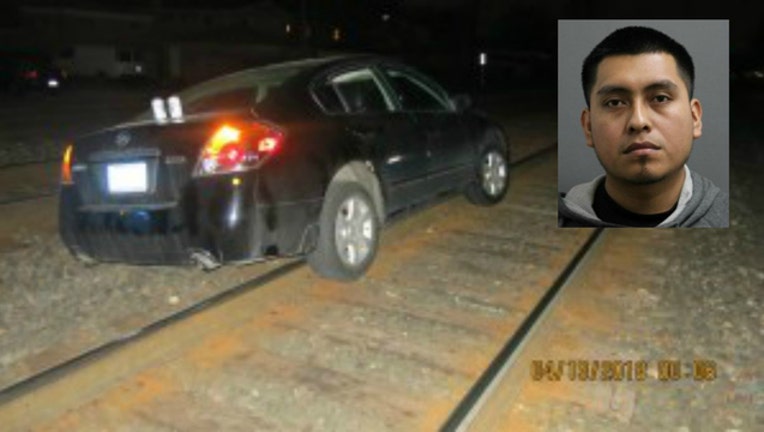 DUI suspect had a beer, got car stuck on railroad tracks, police say