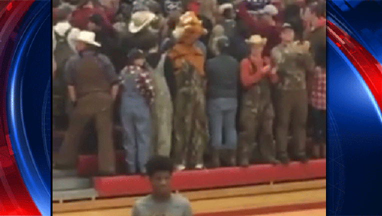 61b1da7e-white-students-turn-backs-on-black-team_1481833429375-407693.gif