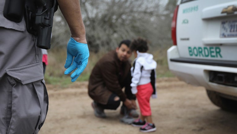 68737b1d-GETTY Separating families 090718_1536353469411.jpg-407693.jpg