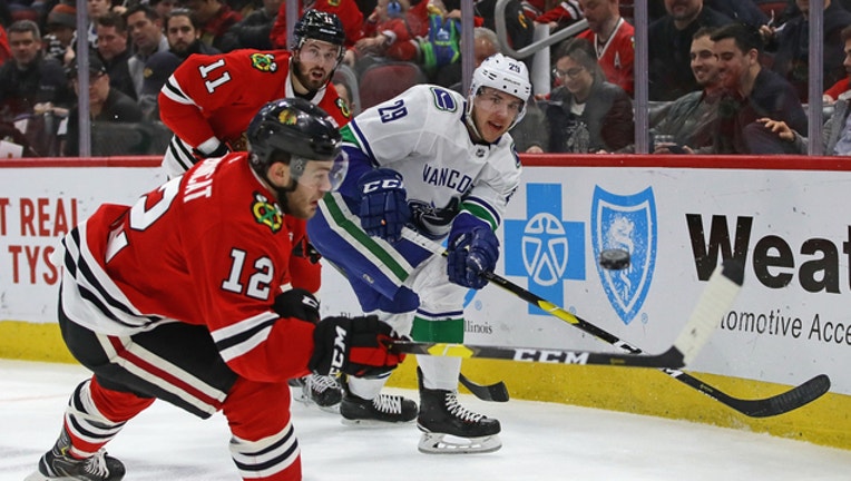 69357d21-GETTY-Blackhawks-Canucks_1552995506706.jpg