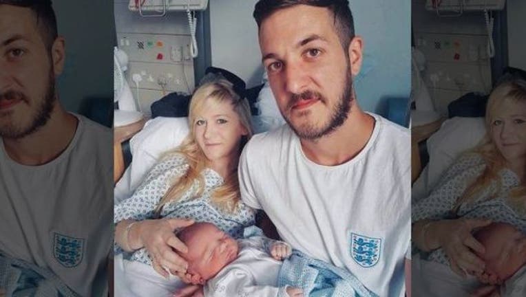 70a08f7c-Connie Yates, Chris Gard and their baby Charlie Gard in a handout photo from the family