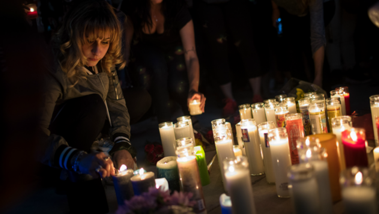 7daaa1cb-GETTY-Las-Vegas-victims-memorial-tribute_1507039102471.png