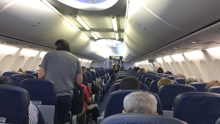 Passengers stuck on a United Airlines flight during a ground stop because of computer problems (Photo - Kelly O'Bray)