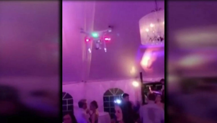 8b2f82e4-Wedding guests sue groom over drone accident at reception