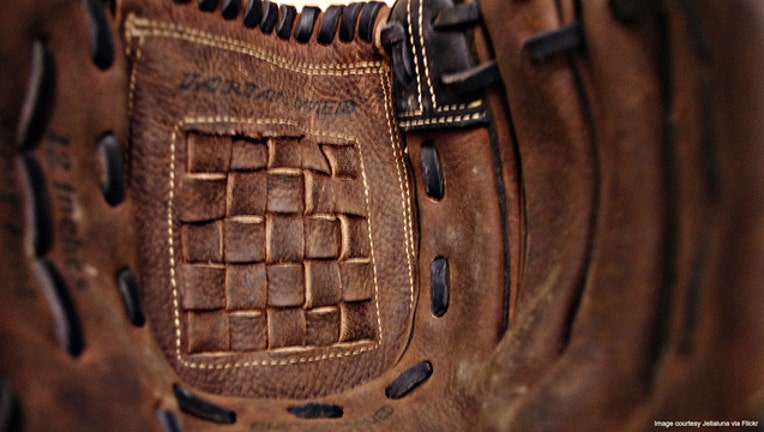 976a9c96-Softball glove stock photo