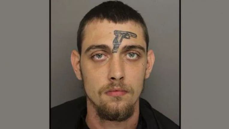 9837530e-gun tattoo_1529446924625.jpg-405538.jpg