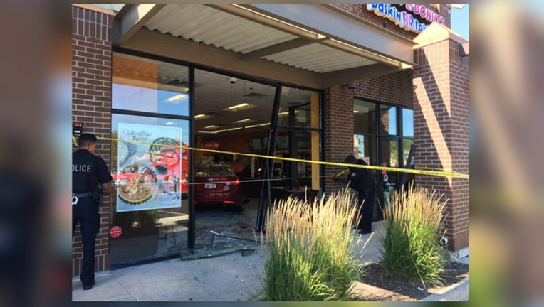 af86f8c4-A car crashed through the front of this Dunkin Donuts in Evanston, Illinois on Sunday.