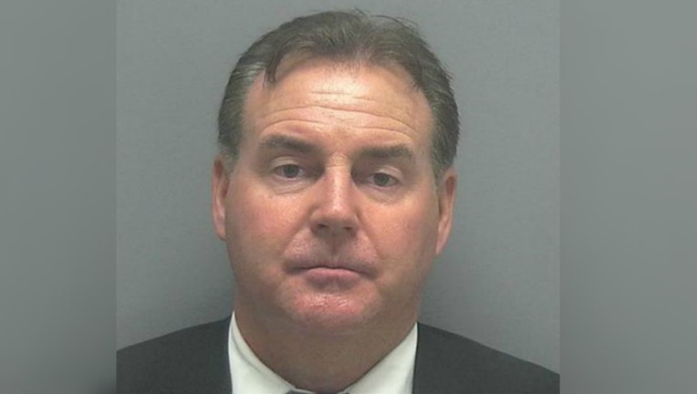 b19fa141-Pilot charged with having a loaded gun in his suitcase