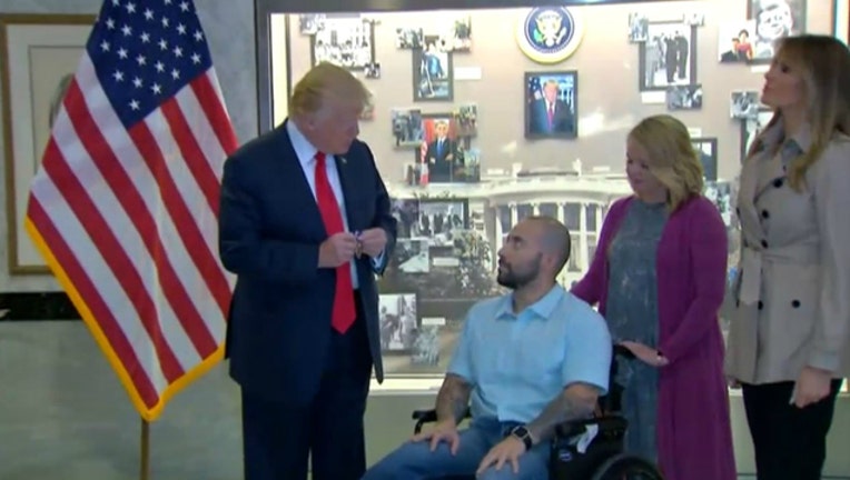 b43c71c8-Trump awards a Purple Heart to Sgt. 1st Class Alavro Barrientos