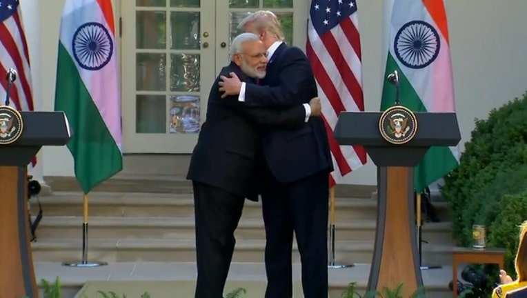 bbfa38c3-trump hug india PM_1498523876373.jpg