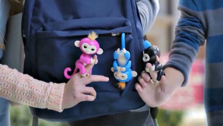 bed499c1-This is a still image of real Fingerlings from a Fingerlings ad.