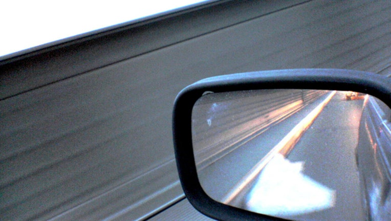 c59c5420-Stock image of side mirror on car from Ben Chun via Flickr