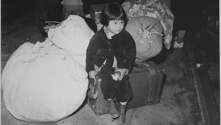 d4c8b8b9-A girl of Japanese ancestry is moved to an internment camp during World War 2.