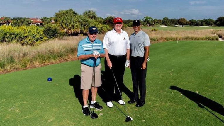 ebb24c58-Trump-golf-cropped_1549133649329.jpg