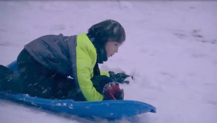 f0bea9b7-Sledding in the snow