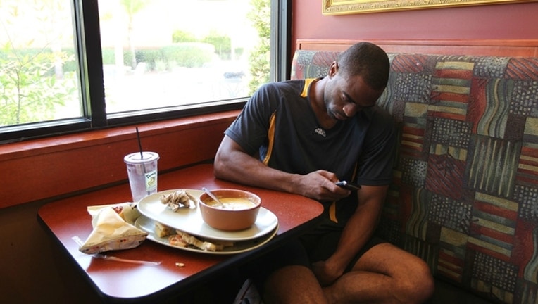 f920124a-GETTY-eating-iphone_1516729057740.jpg
