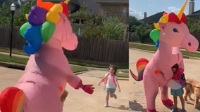 Magical moment: Mom surprises daughter at bus stop dressed in giant pink unicorn Halloween costume