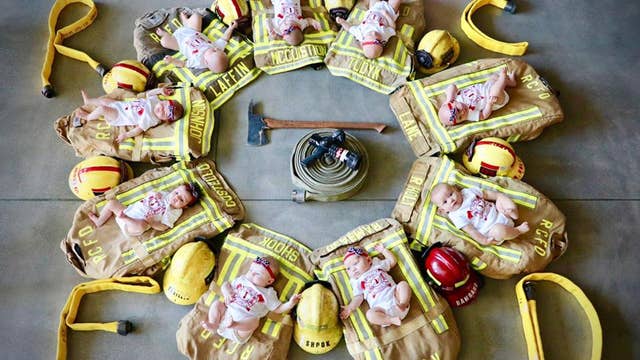 Fire department holds photo shoot for 9 babies born within months of each other