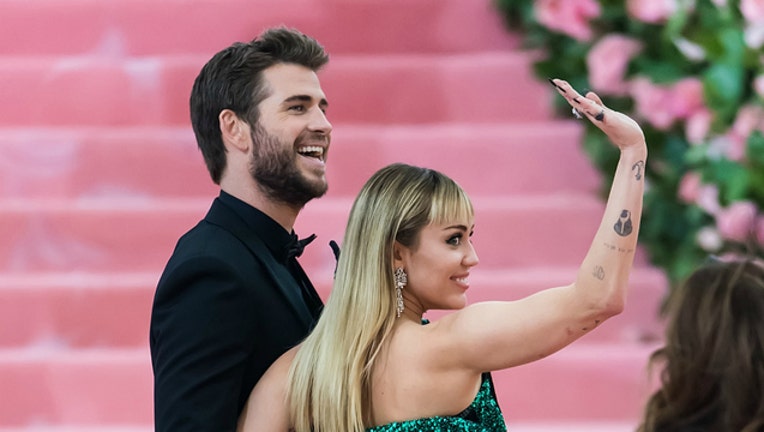 dc4a0372-GETTY Liam Hemsworth and Miley Cyrus