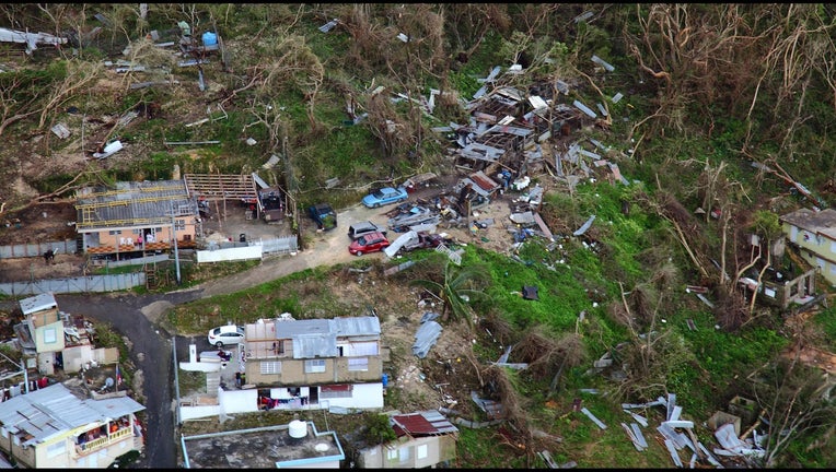 Homes lay in ruin as seen during a flyover of Puerto Rico after Hurricane Maria on Sept. 23, 2017.