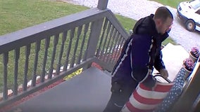 FedEx man fixes stars and stripes during delivery