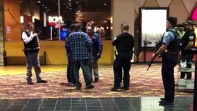 Panic at 'Joker' in Chicago, and two men are taken away in handcuffs