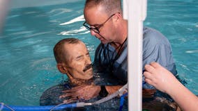 Wheelchair-bound Alabama man who is dying of cancer gets baptized as final request