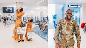 Wife, kids dress in T-Rex costumes to welcome home husband from deployment