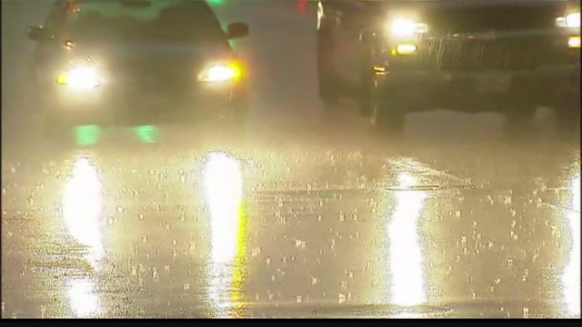 Six killed when pounding rain sweeps cars off Indiana road
