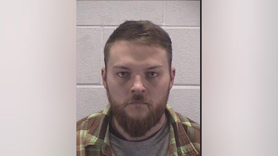 Suburban man accused of missing target, striking neighbor in the knee with arrow