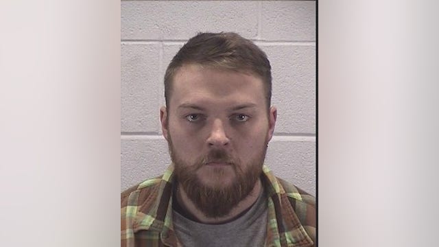 Suburban man accused of missing target, striking neighbor in the knee with arrow