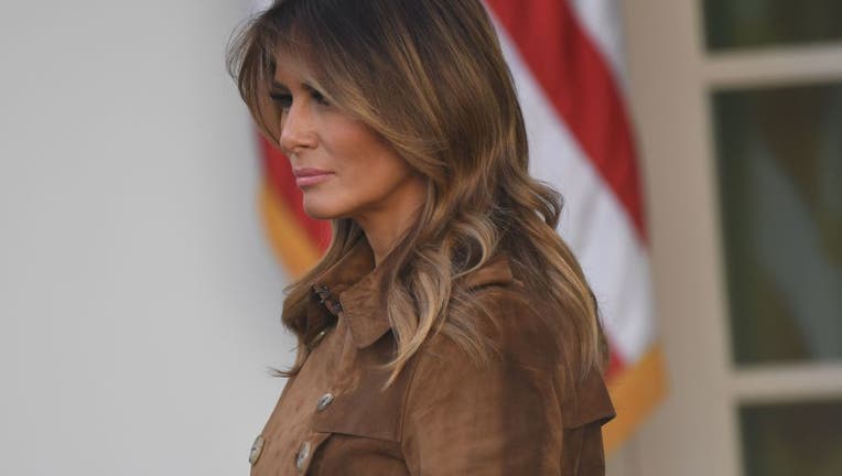 First Lady Melania Trump listens as US President Donald Trump speaks before he pardons the National Thanksgiving Turkey during a ceremony in the Rose Garden of the White House in Washington, DC on November 26, 2019. (Photo by SAUL LOEB / AFP via Getty Images)