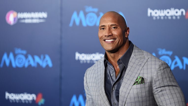 FILE - Dwayne Johnson and his family have tested positive for COVID-19. Johnson is seen at the AFI FEST 2016 Presented By Audi premiere of Disney's 