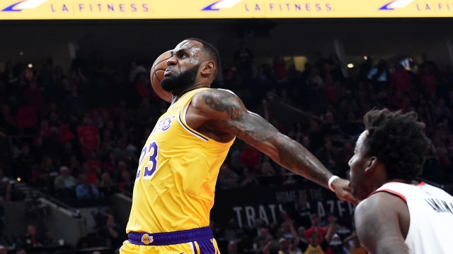 LeBron James wipes away tears during tribute, says he doesn't know if he'll play in Cleveland again